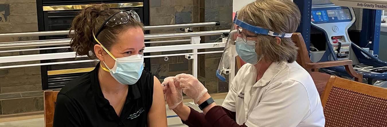 Dayspring Villa team member receiving vaccination