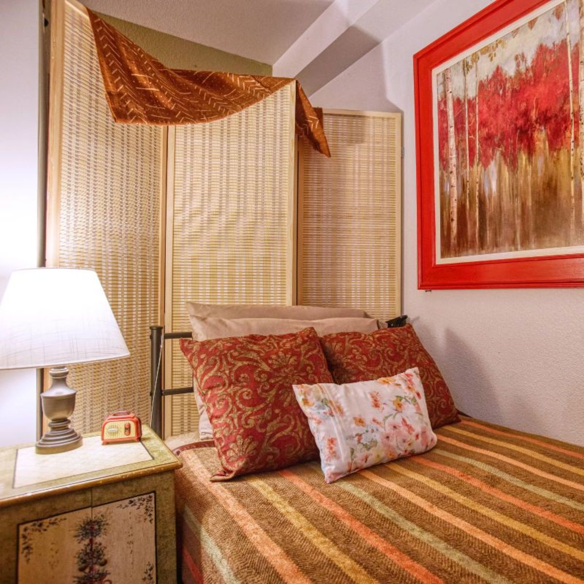 Dayspring Villa Assisted Living Community in Denver, CO - twin bed red bedroom square