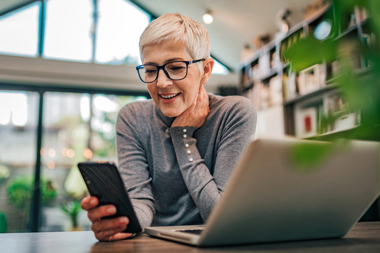 Dayspring Villa Assisted Living Community in Denver, CO - dayspring villa adult woman researching on laptop and iphone