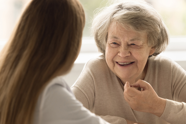 Dayspring Villa Assisted Living Community in Denver, CO - dayspring villa senior woman chatting with caregiver