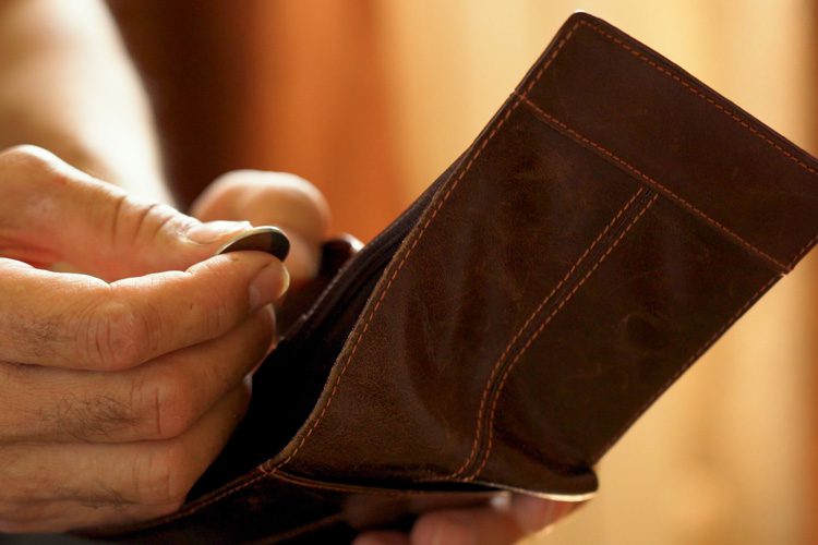 Dayspring Villa Assisted Living Community in Denver, CO - dayspring villa hand pullling coin out of wallet