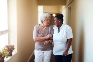 Dayspring Villa Assisted Living Community in Denver, CO - caregiver and resident