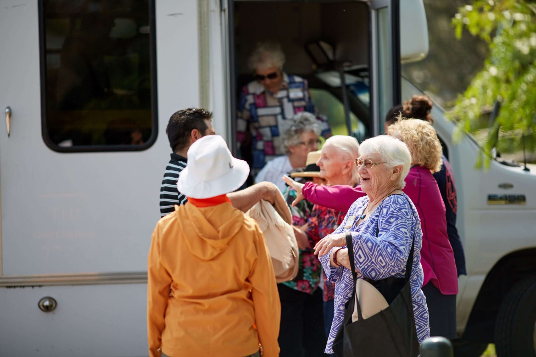 Dayspring Villa Assisted Living Community in Denver, CO - older adults standing by community van landscape