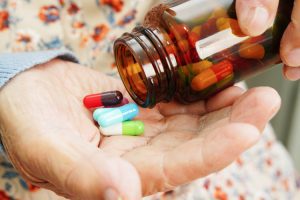 Dayspring Villa Assisted Living Community in Denver, CO - hand with pills