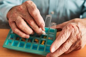 Dayspring Villa Assisted Living Community in Denver, CO - dayspring villa man filling pill container