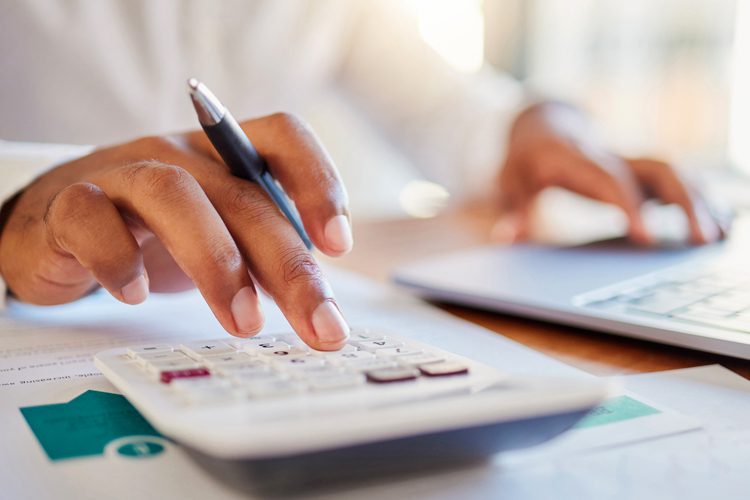 Dayspring Villa Assisted Living Community in Denver, CO - dsv hand using calculator close up