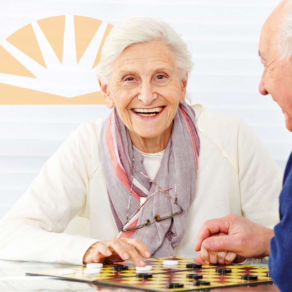 Dayspring Villa Assisted Living Community in Denver, CO - dsv senior woman and man playing checkers