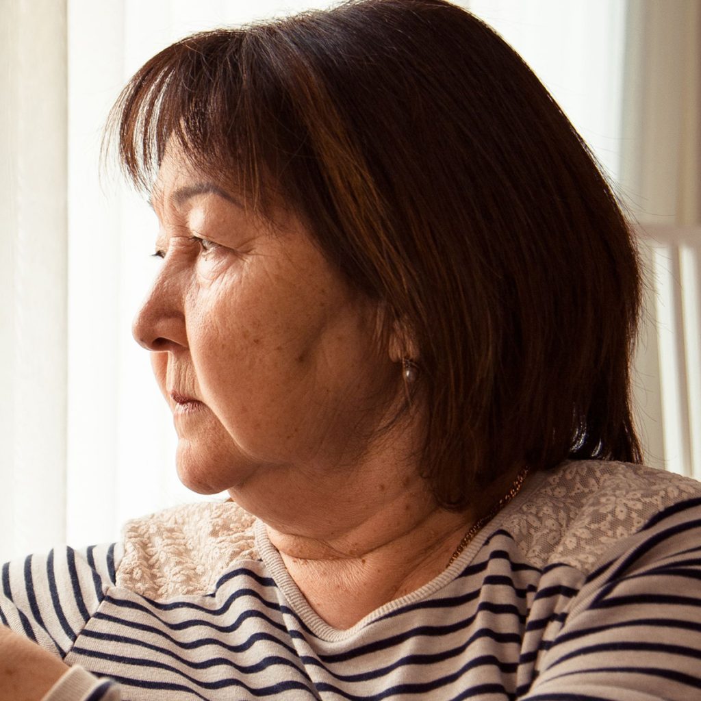 Dayspring Villa Assisted Living Community in Denver, CO - dayspring villa diverse senior woman staring out window