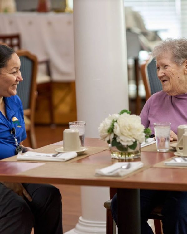 Dayspring Villa Assisted Living Community in Denver, CO - resident with staff enjoying coffee square