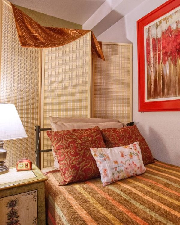 Dayspring Villa Assisted Living Community in Denver, CO - twin bed red bedroom square